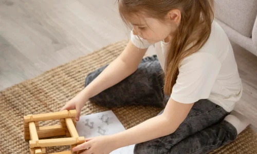 full-shot-girl-playing-floor