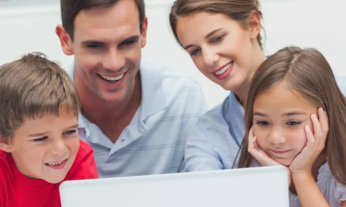 parents-children-using-laptop
